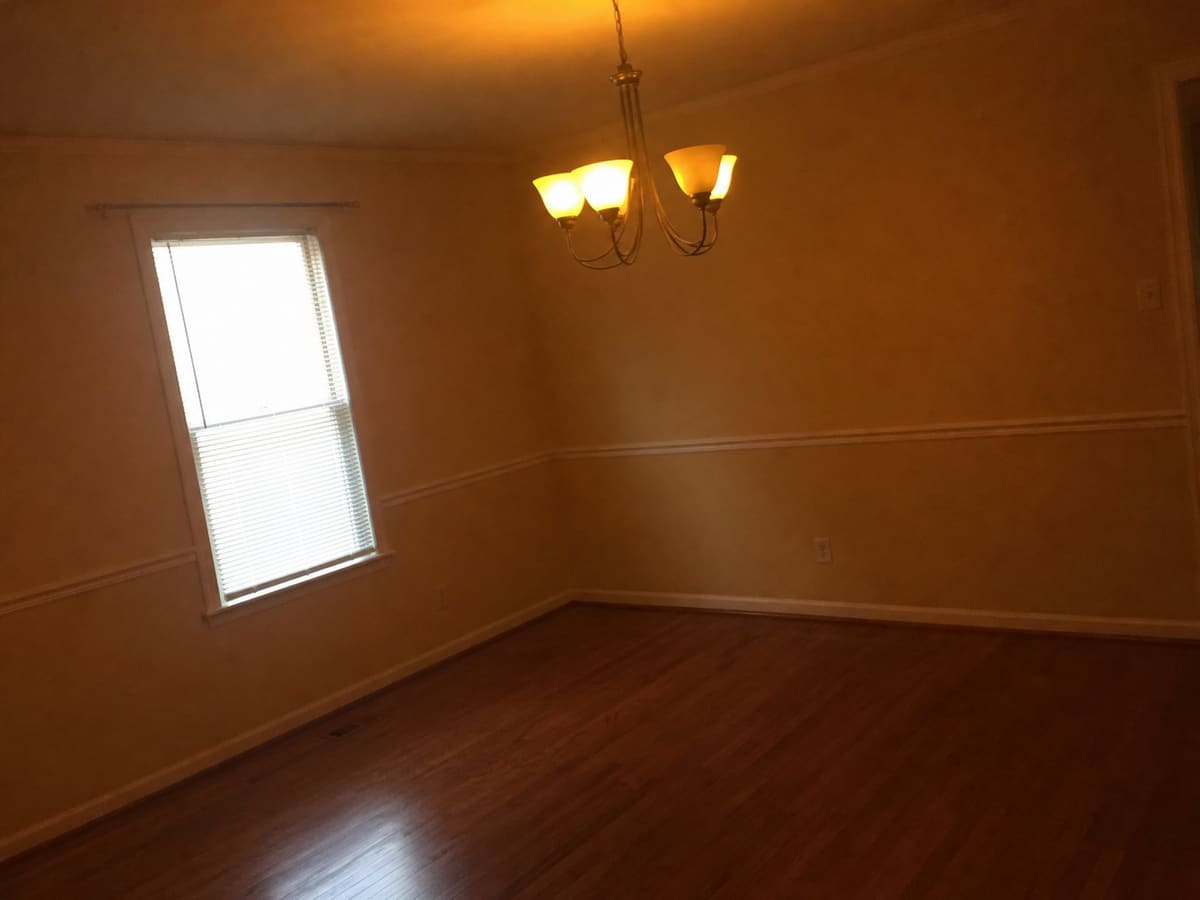 Dark, yellow-tinted and tilted dining room photo before photo repair