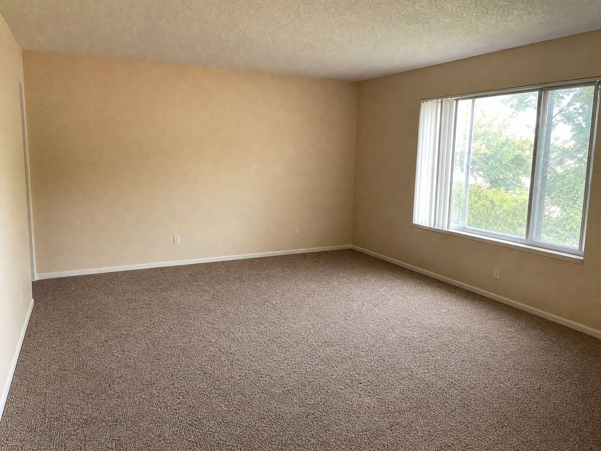 The same living room emptied with virtual furniture removal