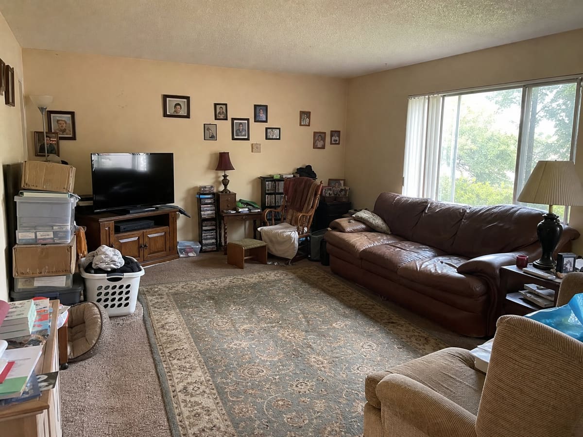 Cluttered, furnished living room before virtual furniture removal